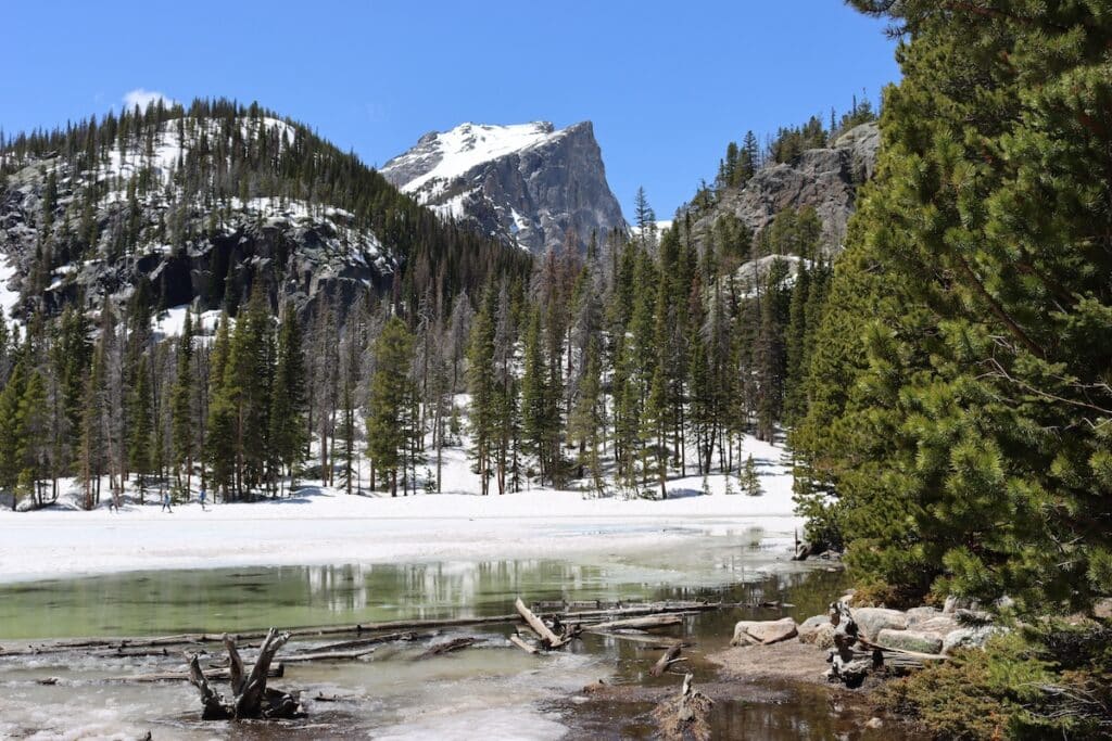 a view of hallett peak from nymph lake in rocky mountain national park