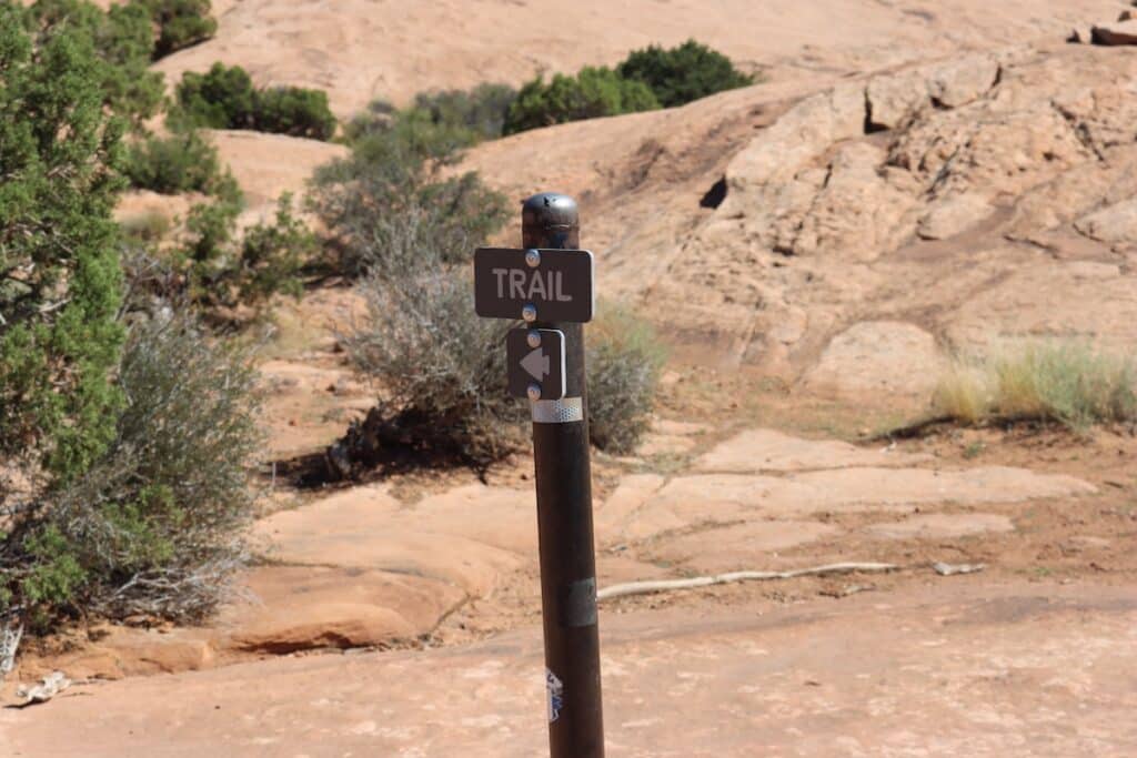 a trail sign for the delicate arch hike