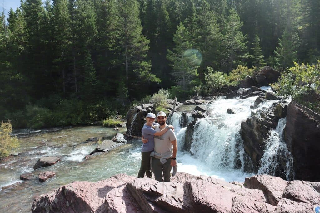 alex and daniel at redrock falls in glacier national park