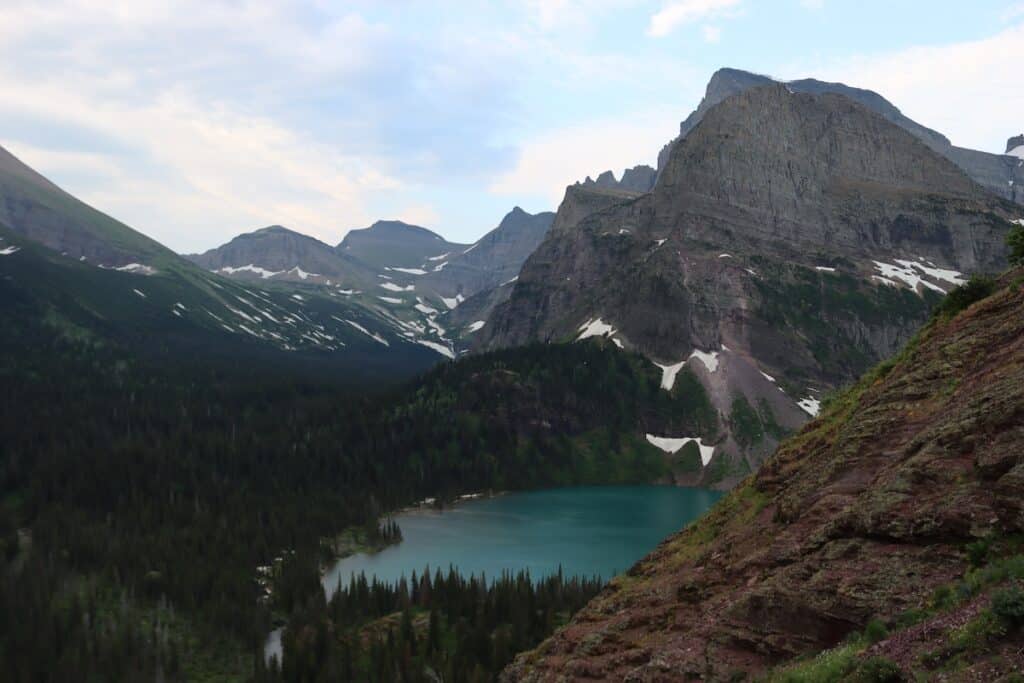 first glimpse of grinnell lake on the grinnell glacier hike