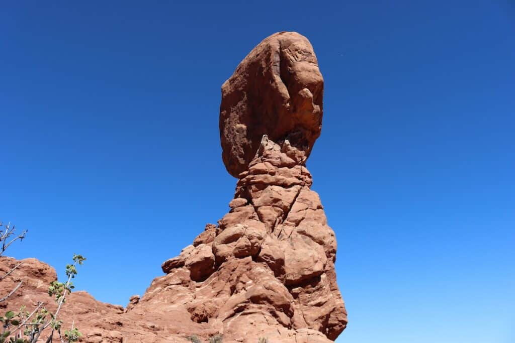 a view of balanced rock in arches national park from one side