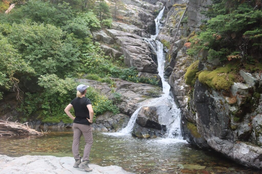 alex wearing hiking boots in glacier national park